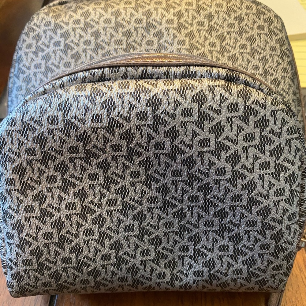 Two DKNY makeup bags, one small, one medium